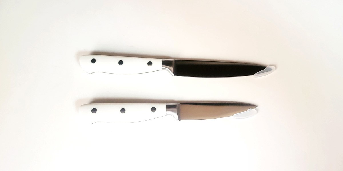Two Carote 14-Piece Forged Knife Set knives displayed on kitchen counter