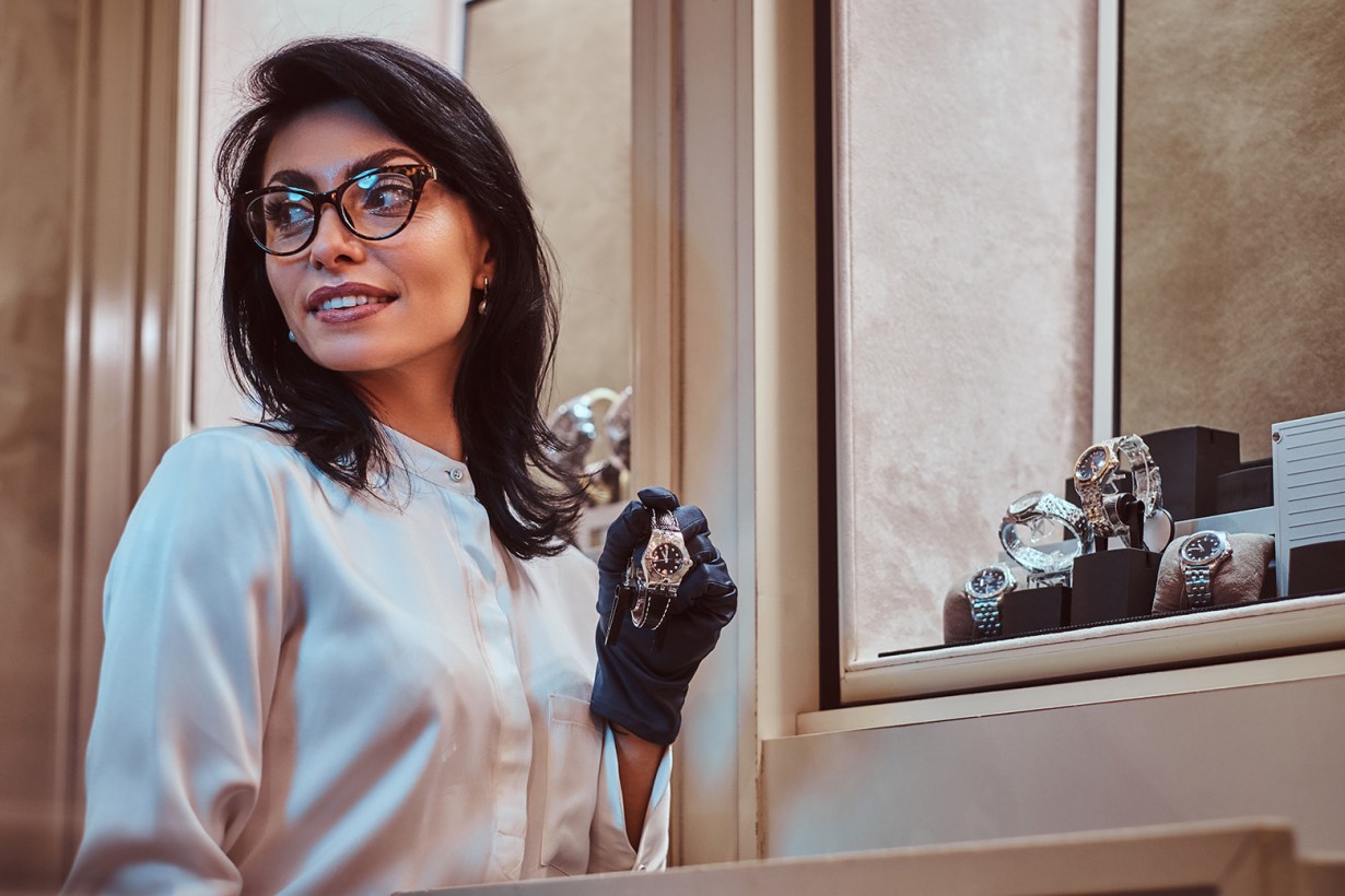 woman assistant assisting a watch buyer