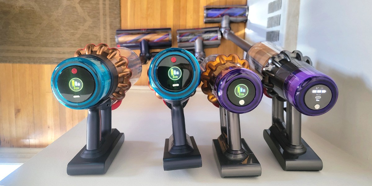 Top view of four Dyson stick vacuums